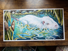 Load image into Gallery viewer, A vertical art print featuring a detailed illustration of a white bnutrioa surrounded by blue, green, and yellow abstract water-like patterns, displayed on a wooden surface.